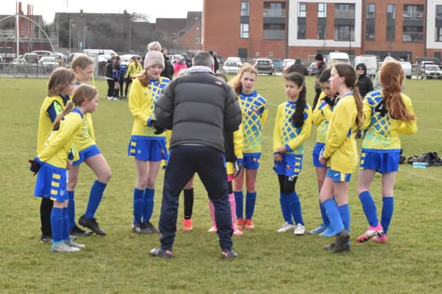 Damian Eatwell giving the half time team talk in the Girls' game    PICTURES BY IAIN WILLCOCKS