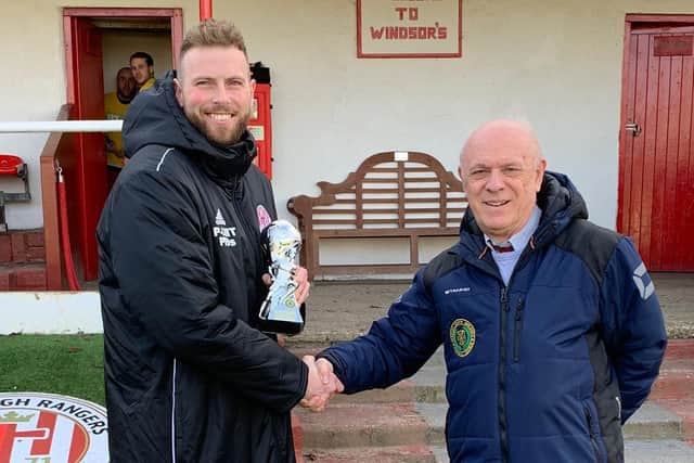 Risborough Rangers captain Joel Read receiving December’s Team of the Month and Respect award from SSML official John Chidley