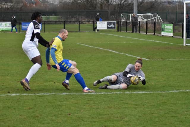 James Weatherill makes a save for Dynamos, with Kyle Lincoln defending
