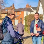 Tan Dhesi and Mark Brown talk to a local cyclist in Winslow