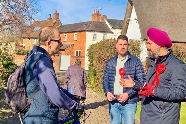 Tan Dhesi and Mark Brown talk to a local cyclist in Winslow