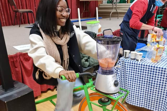 A customer pedals the smoothie bike