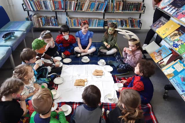 Children from Rainbow Pre-School at Winslow C of E School enjoy a royal garden party in the school library