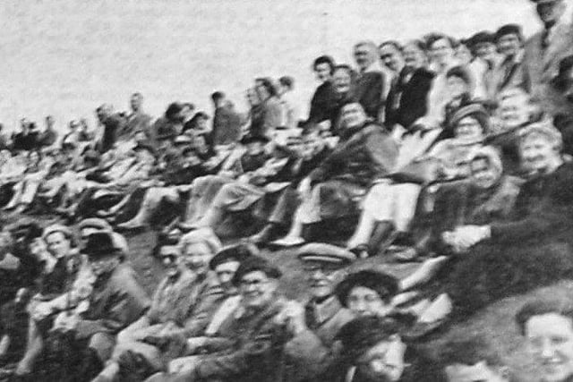 Spectators lining Worthing seafront, where hundreds of deckchairs  were set up
