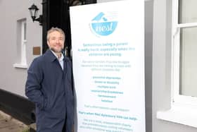 A Barratt David Wilson Homes representative providing the donation to the Aylesbury charity