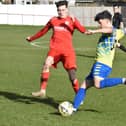 Alex Mitchell clearing the ball for Aylesbury Vale Dynamos against Flackwell Heath (Pictures by Iain Willcocks)
