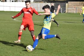 Alex Mitchell clearing the ball for Aylesbury Vale Dynamos against Flackwell Heath (Pictures by Iain Willcocks)