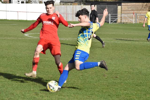 Alex Mitchell clearing the ball for Aylesbury Vale Dynamos against Flackwell Heath (Pictures by Iain Willcocks)