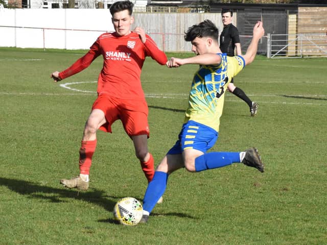 Alex Mitchell clearing the ball for Aylesbury Vale Dynamos against Flackwell Heath (Pictures by Iain Willcocks)