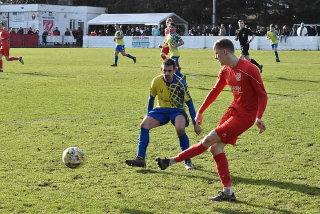 Aylesbury Vale Dynamos forward Chris Stapleton in action against Flackwell Heath