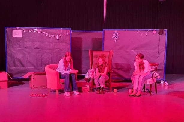 Hannah Bush, Hattie Foden-Ellis, and Elysia Drew performing their very own play at Aylesbury High School