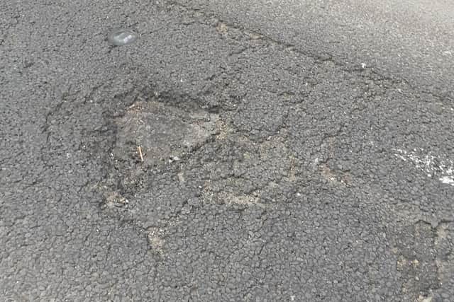 The road surface is badly damaged, say residents