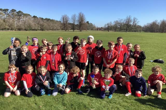 Turnfurlong Junior School runners celebrating becoming District Champions for the tenth time since 201