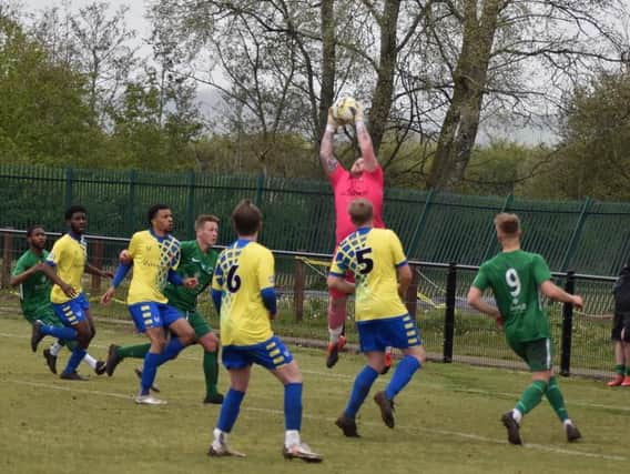 Goalkeeper Dan McAteer collects the ball for Aylesbury Vale Dynamos against Newport Pagnell (Picture by Iain Willcocks)