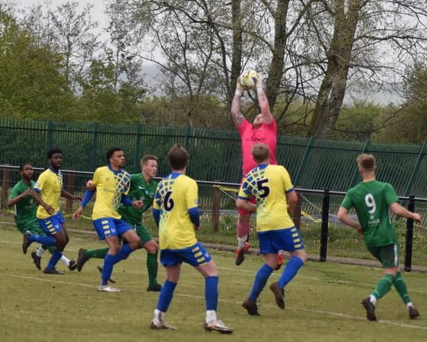 Goalkeeper Dan McAteer collects the ball for Aylesbury Vale Dynamos against Newport Pagnell (Picture by Iain Willcocks)
