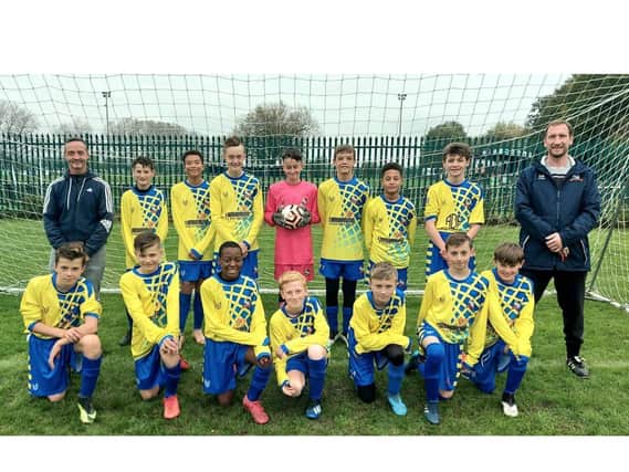 The Under 13s Dynamos with coach Woody (right)