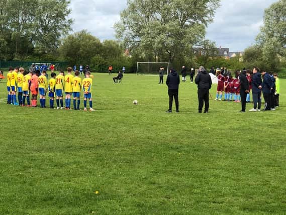 The Under 11s Youth in a minute's silence for vice-chairman Steve MacDonald before their game at the weekend