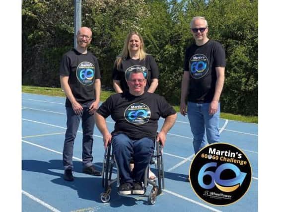 Martin and members of the WheelPower Team on the famous track at Stoke Mandeville Stadium as the 60@60 challenge begins.