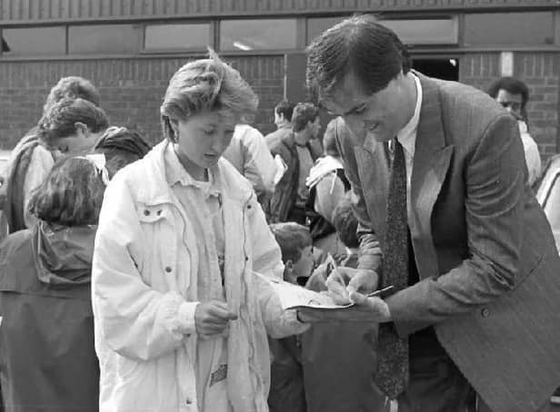 Aylesbury United's Cliff Campbell signing autographs before the game which attracted a record crowd of 6,000 to Buckingham Road