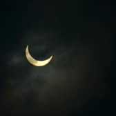 The moon partially covers the sun during an annular solar eclipse in June 2020. (Photo: Diptendu DUTTA / AFP)