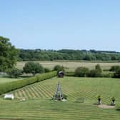 The house is surrounded by grounds and parkland
