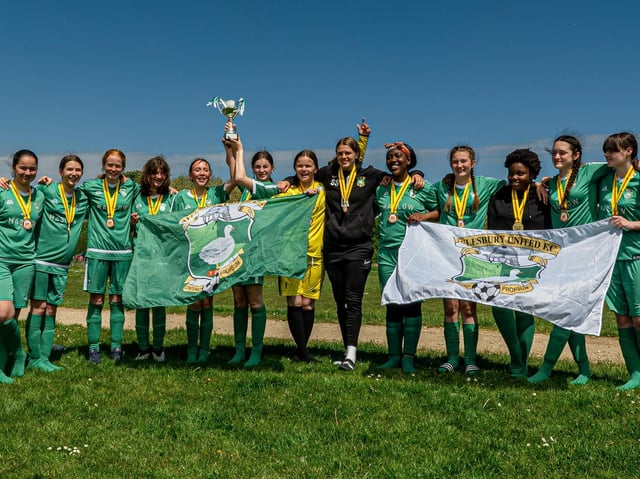 Aylesbury United Girls Under 14s Greens celebrate with their medals and Division 2 trophy