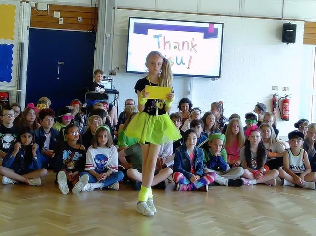 Year 5 doing their journey through the decades - they all dressed as someone from one of the decades