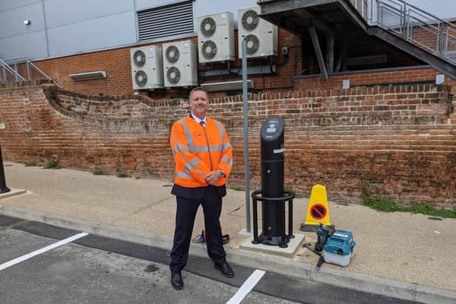 Cllr. Steven Broadbent, Cabinet Member for Transport, next to one of the new EV charging points