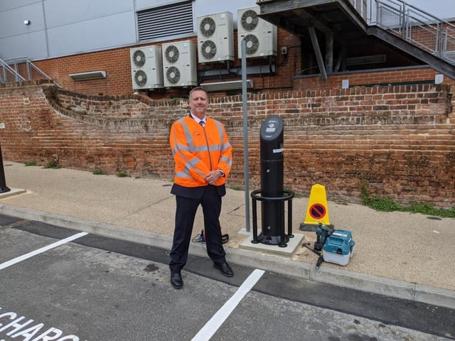 Cllr. Steven Broadbent, Cabinet Member for Transport, next to one of the new EV charging points