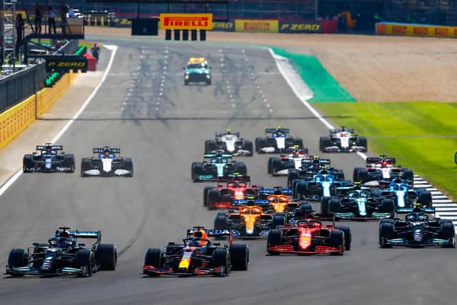LIGHTS OUT: Lewis Hamilton and Max Verstappen battle at the start of the British Grand Prix (Photo Daimler AG)