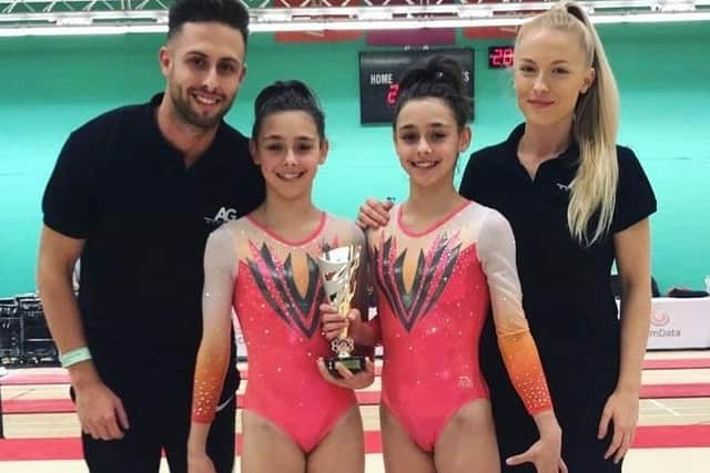 Aylesbury Gymnastics Academy coaches Joshua and Molly Richardson with Jessica and Jennifer in 2018