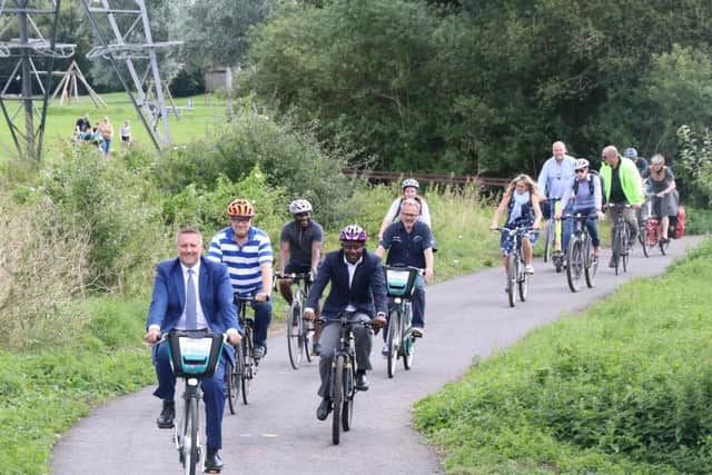 Councillor Broadbent leading officials down the new path