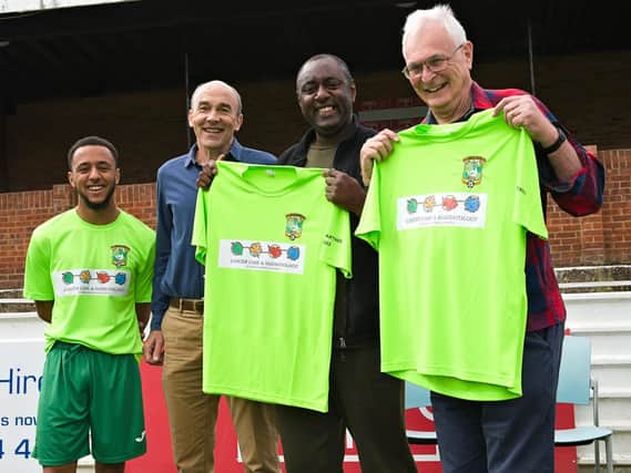 Cliff Hercules and John Marsden (CCHF Trustee) display Aylesbury United’s new team warm-up strip, while Max Hercules (left) and Dr Andy Theobald (CCHF Trustee) look on.