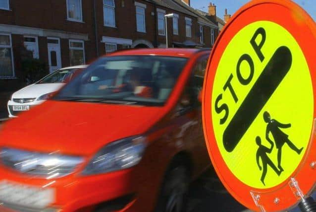 Lollipop patrol sign