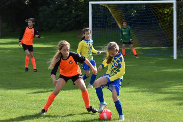 Action between Aylesbury Vale Dynamos and Leighton Corinthians U13s girls