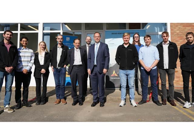 Outside Flare Bright's new premises: Greg Smith MP, centre right, with chief commercial officer Chris Daniels, centre left, and CEO Kelvin Hamilton behind them