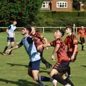 Paul Adam challenges in Dynamos' game with Buckingham Athletic (Picture by Iain Willcocks)