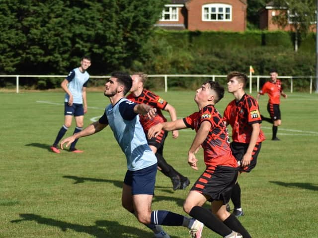 Paul Adam challenges in Dynamos' game with Buckingham Athletic (Picture by Iain Willcocks)