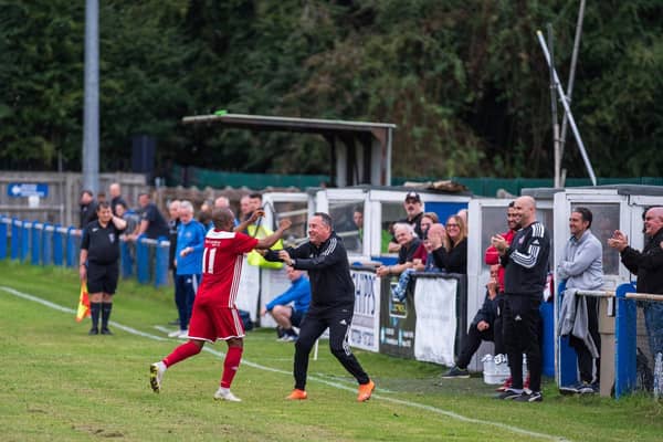 Risborough Rangers' Sam Pekun, scorer of their second goal, celebrating with Manager Mark Eaton (Picture by Charlie Carter)