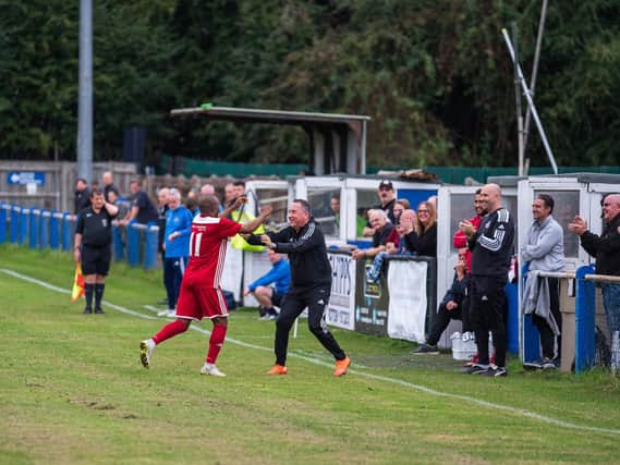 Risborough Rangers' Sam Pekun, scorer of their second goal, celebrating with Manager Mark Eaton (Picture by Charlie Carter)