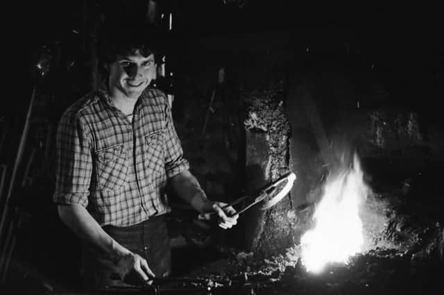 23-years-old blacksmith and farrier John McDaid at work at his forge in Moville.