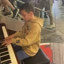 Max playing to the crowds in Euston Station.