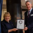 Glyn receiving his award from The Lady Dannatt