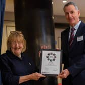Glyn receiving his award from The Lady Dannatt