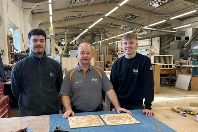 Two apprentices working with the company