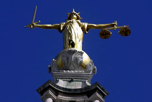 The Scales of Justice on top of the Old Bailey, London.