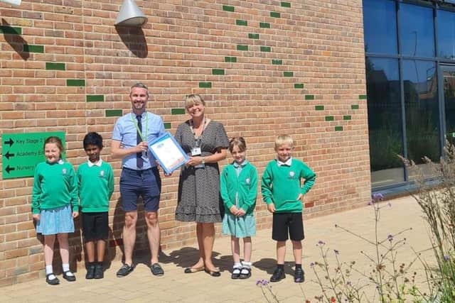 Students from Kingsbrook View Primary School holding their Modeshift STARS Certificate of Accreditation