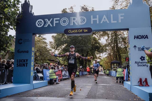 A runner crosses the line in 2024's Oxford Half.