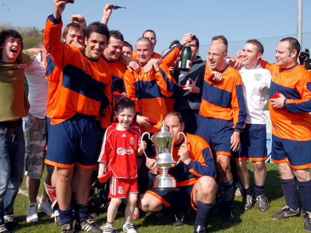 Celebrations for Portland Arms after victory over Forest Town in a Sunday League cup final.