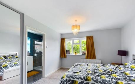 One of the double bedrooms in the property, which has four bedrooms overall.